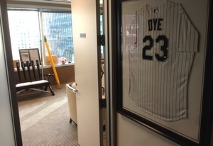  A framed White Sox Jermaine Dye jersey greets all visitors to Andrew Berlin's office. 